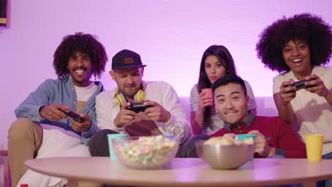 Group of Friends Enjoying Video Games with Snacks