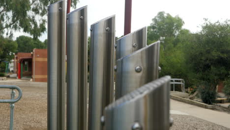 close up, outdoor music pipes at elementary school playground