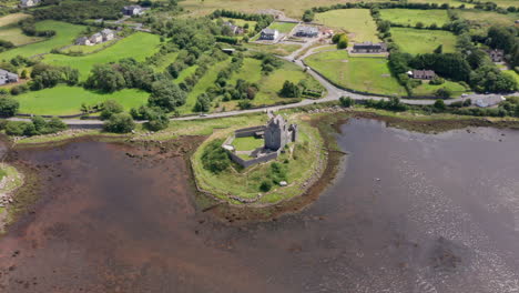 aerial shot high above dunguaire castle in county galway, ireland