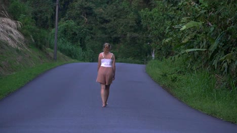 woman walking barefoot on the streets of the costa rican rain forest