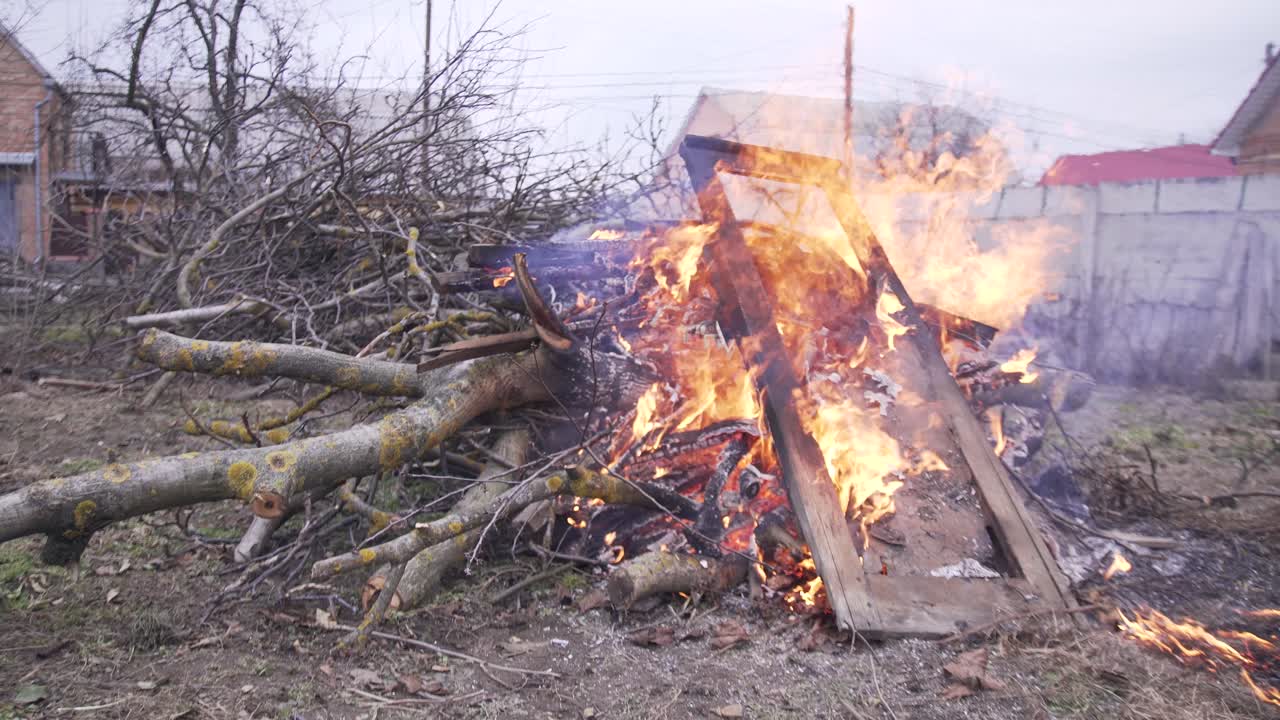 fire from old doors and dry branches of trees