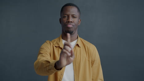 man pointing in studio