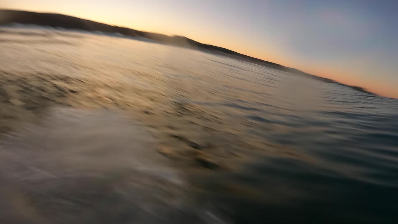 Surfer doing a strong floater on Blue Ocean Wave Surfing Getting Barreled