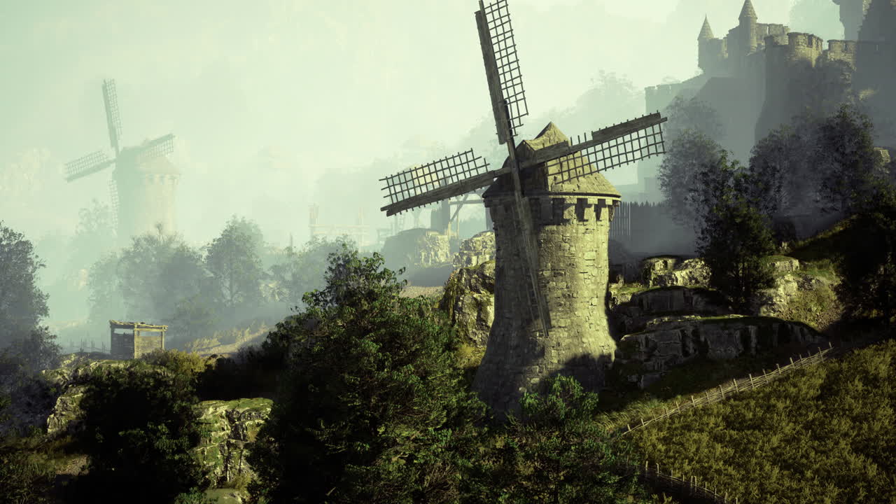 Windmills stand tall in a misty landscape surrounded by lush greenery