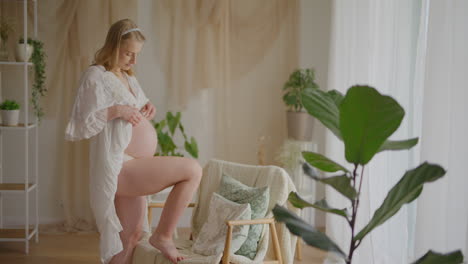 pregnant woman hugging belly in expectation