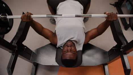 man performing bench press exercise