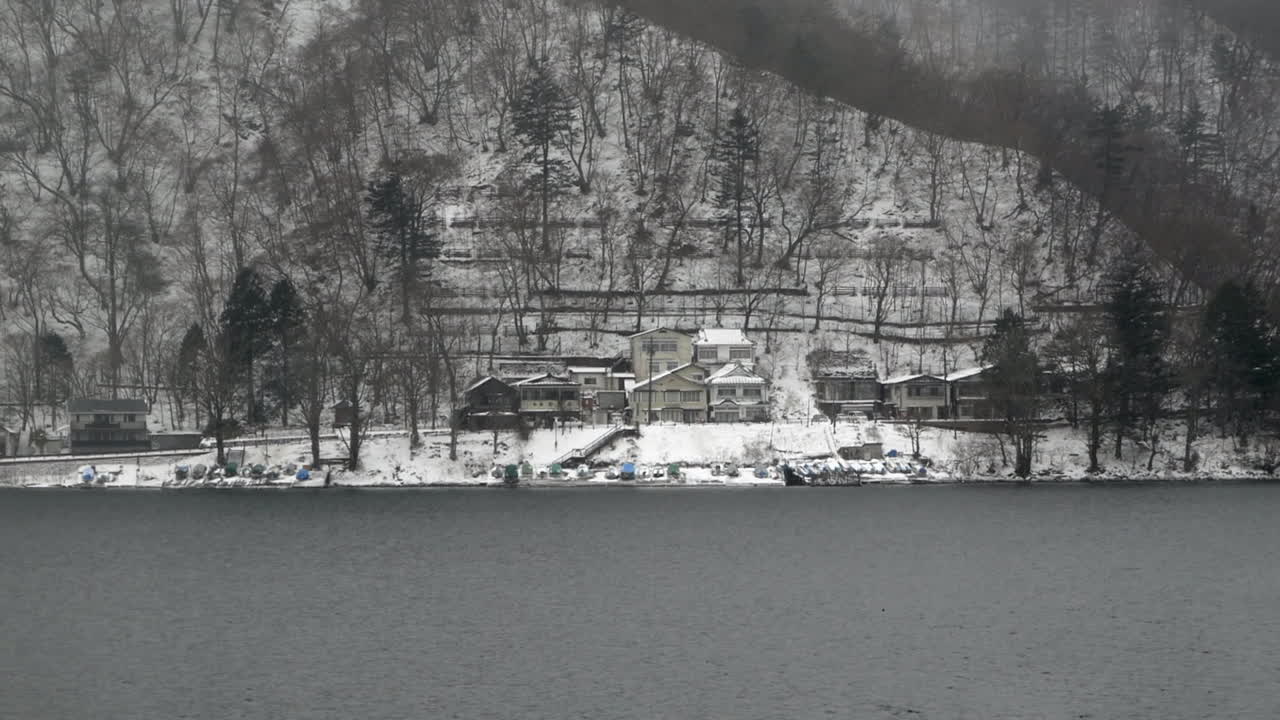 Snow covered empty vacation homes along the shore of Lake Chuzenji, Nikko, Tochigi, Japan.