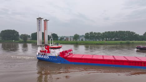 eems traveller cargo ship with rotor sails on a river