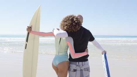 a couple embracing on shore