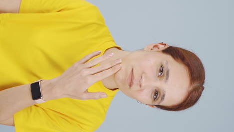 Vertical-video-of-The-woman-who-is-bothered-by-her-pimples.