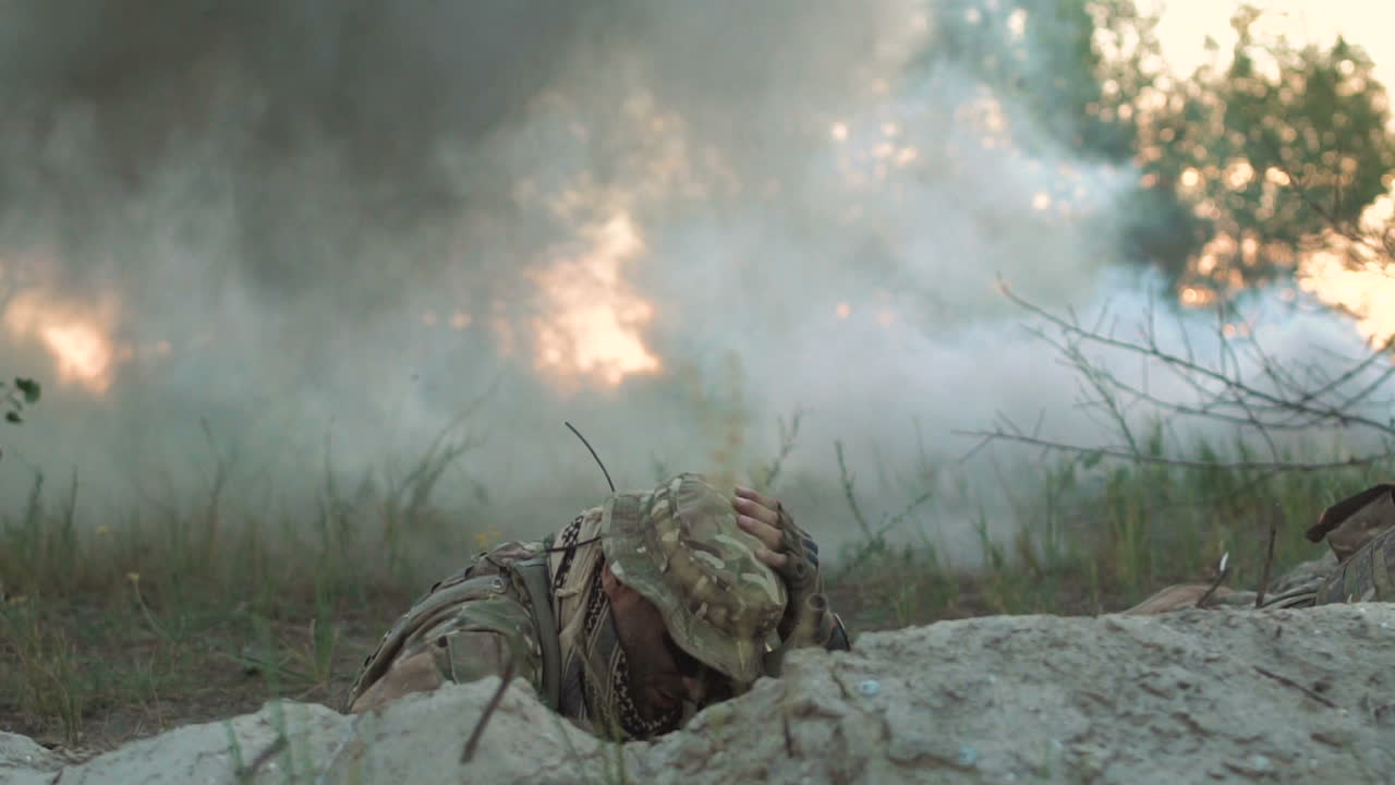 Soldiers Hiding in a Trench During a Smoke Grenade Explosion