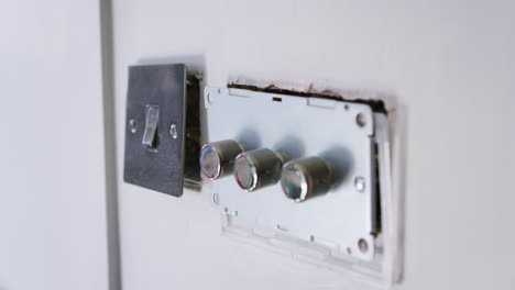 Close-Up-Of-Electric-Light-Switches-And-Dimmers-Being-Fitted