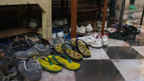shoes lined up on a tile floor