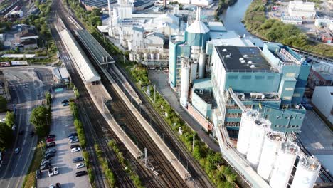 Industrial-chemical-manufacturing-factory-next-to-Warrington-Bank-Quay-train-tracks-aerial-view-top-down-reverse