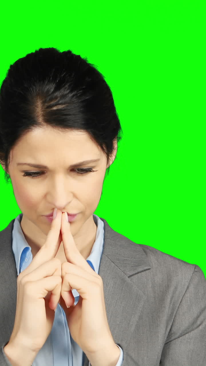 Worried businesswoman holding her head