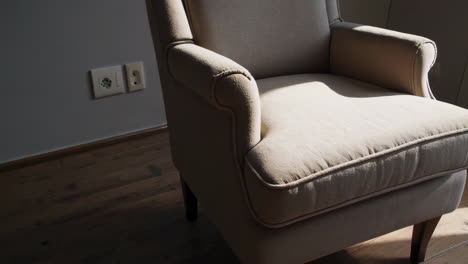 beige armchair in a sunlit room