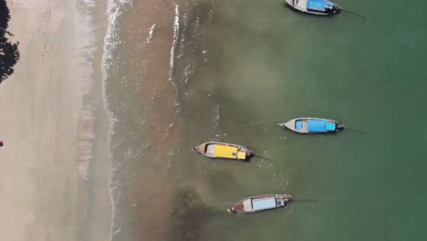 Top-down-aerial-view-of-traditional-longtail-boats,-Ao-Nang,-Krabi,-Thailand