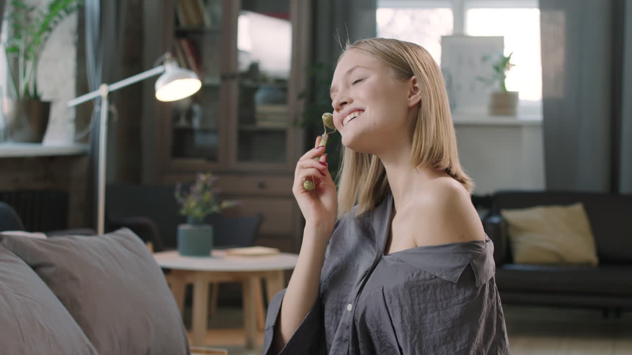 Woman Enjoying Facial Massage At Home