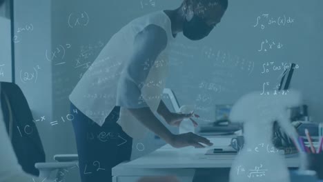 animation of math formulas over afrcian american man in face mask cleaning desk in office