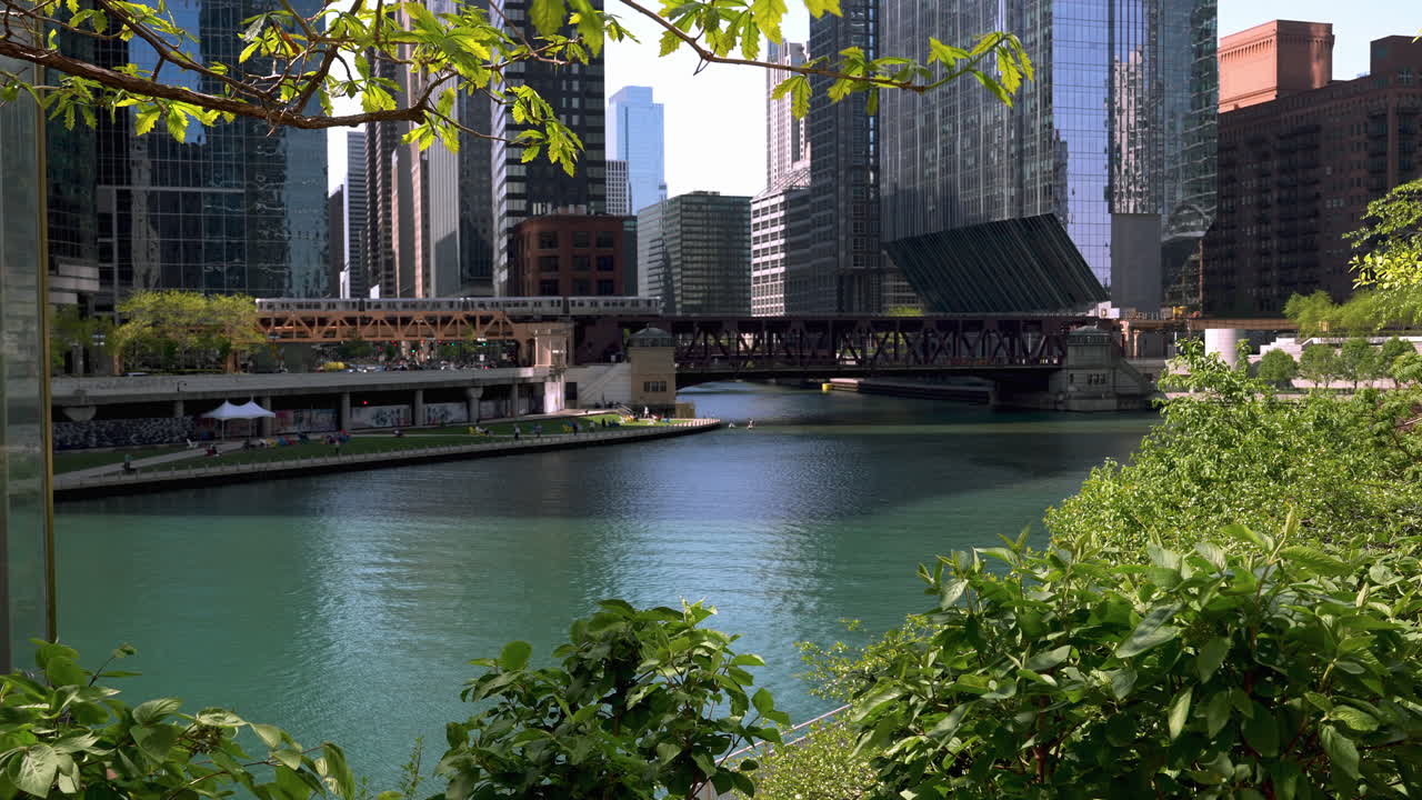 Train moving across a bridge in downtown Chicago, spring day in Illinois, USA