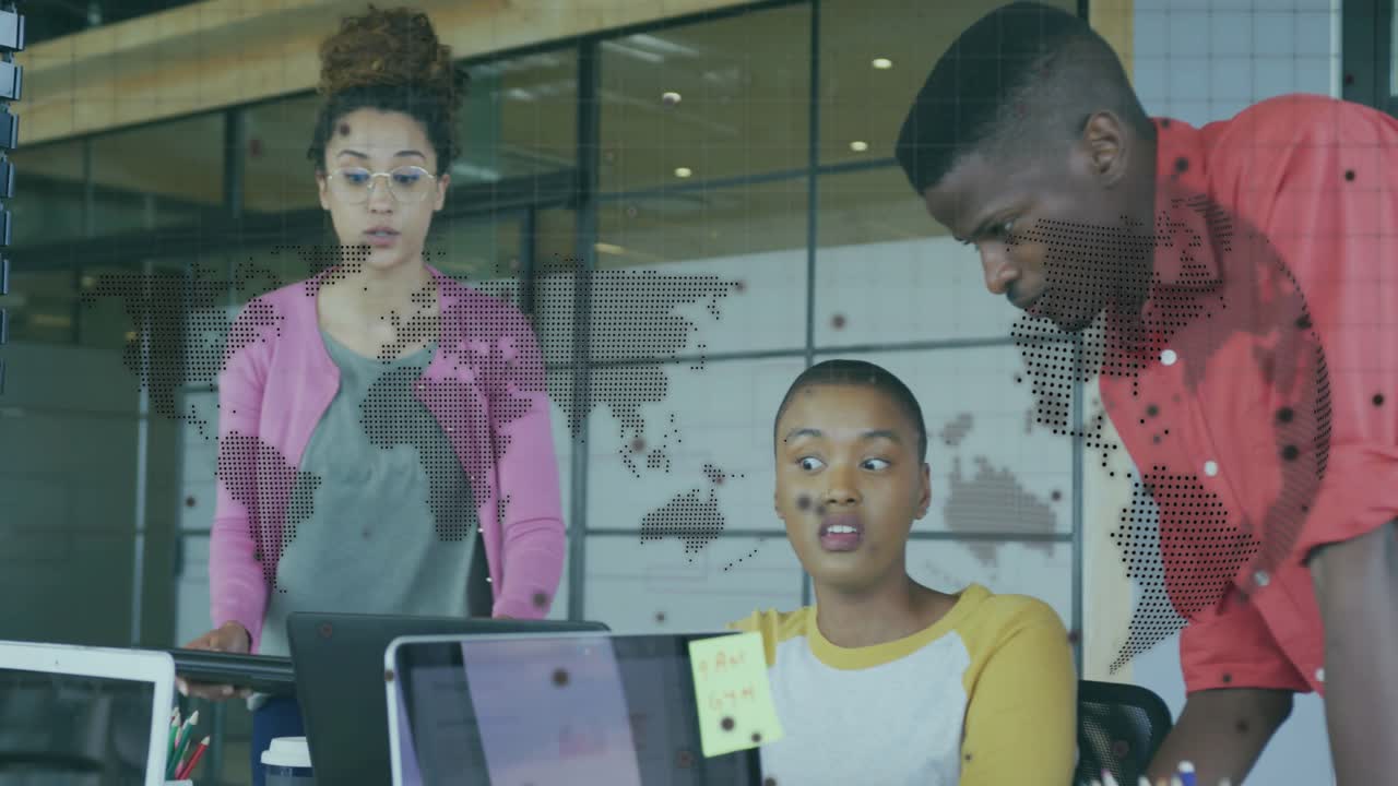 Woman in pink entering with tray starting review while team leaning around laptops in business hub
