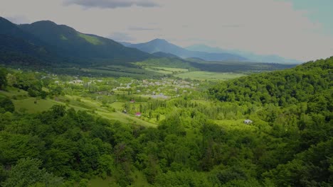 fly over a small town in a green fresh beautiful scenic nature in asia in azerbaijan in baku near iran