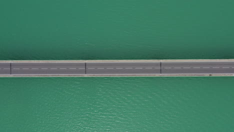 bridge aerial vertical top shot with cars passing left to right, lake france