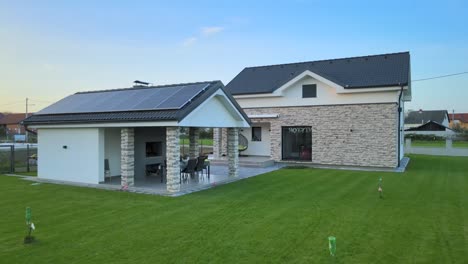 new modern home with solar panels, efficient energy saving renewable house