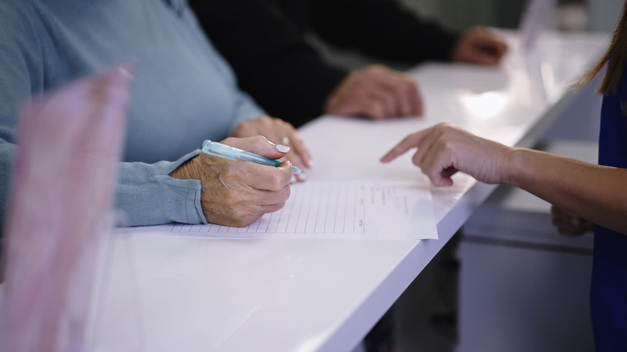 Filling out a form at a clinic reception