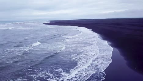 haunting beautiful aerial over a black sand beach in southern iceland 2