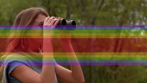Video-of-rainbow-lines-over-happy-caucasian-young-woman