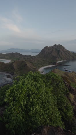 Take-in-the-panoramic-beauty-of-Padar-Island,-Indonesia,-with-its-dramatic-peaks-and-crystal-clear-waters-showcased-from-a-breathtaking-vantage-point