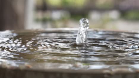 Close-view-of-the-water-of-an-old-fountain-in-slow-motion-in-Granada