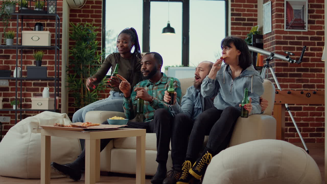 Competitive sports fans watching football match game