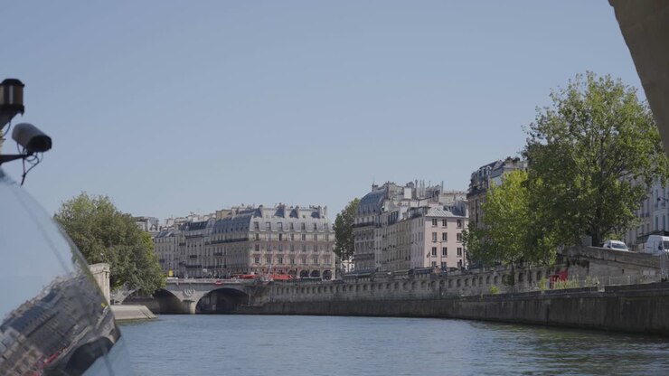 Apartment Blocks On Ile Saint Louis Paris France Viewed From River Seine In Slow Motion