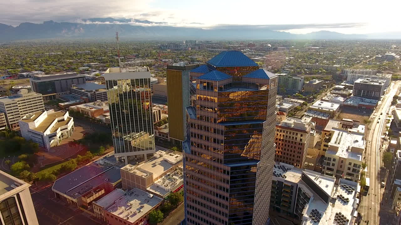 Cinematic drone shot of downtown Tucson Arizona and surrounding urban sprawl