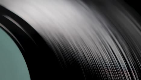 close up, macro shot of old vinyl disc spinning on a record player