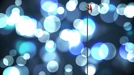 animación del micrófono rerto con el sombrero de santa sobre el bokeh brillante