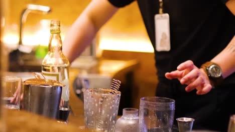 bartender skillfully prepares cocktails at a bar