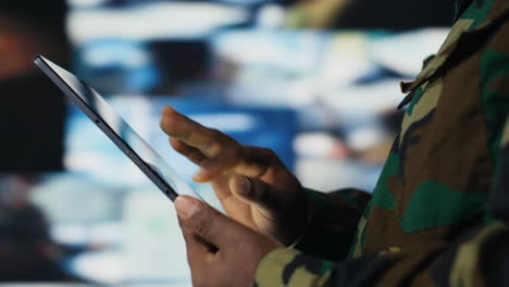 african american army staff monitoring drone and satellite imagery