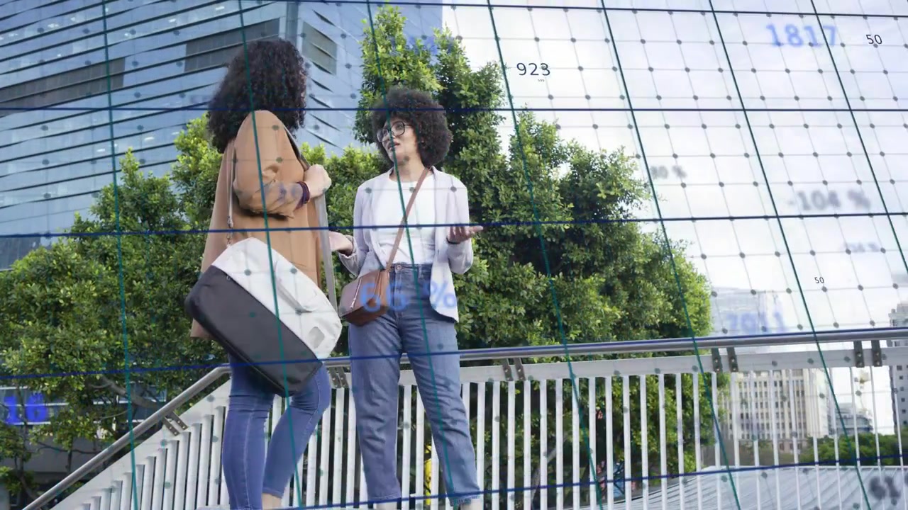 Two women entering left frame, walking up stairs, pausing, talking business under blue grid overlay