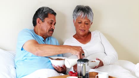 Senior-couple-having-breakfast-in-the-bedroom-4k