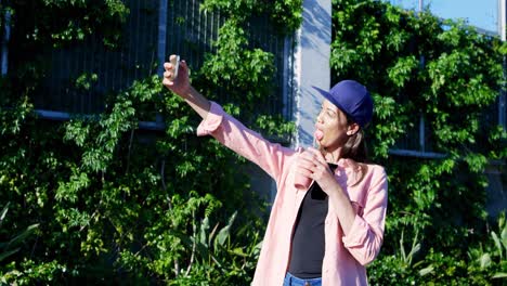 woman taking selfie with mobile phone 4k