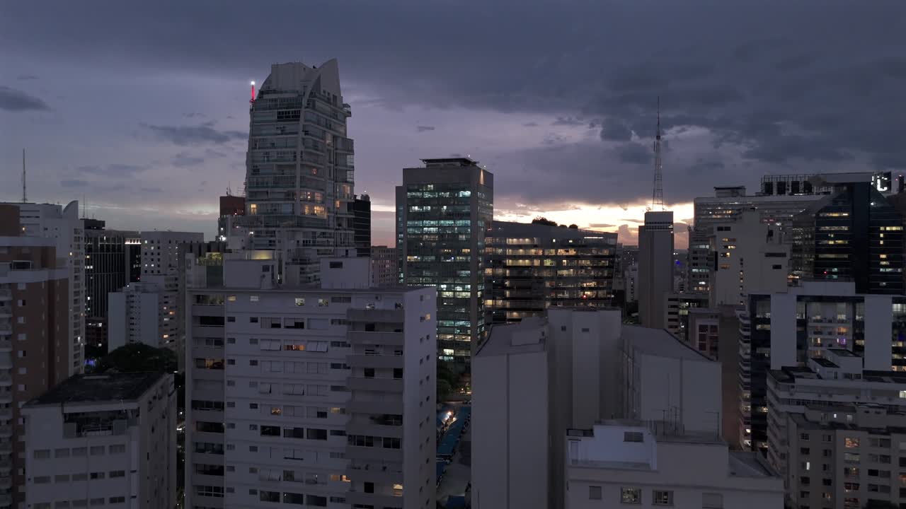 High-rise Buildings Illuminated At Night In Sao Paulo City, Brazil. - aerial descend shot
