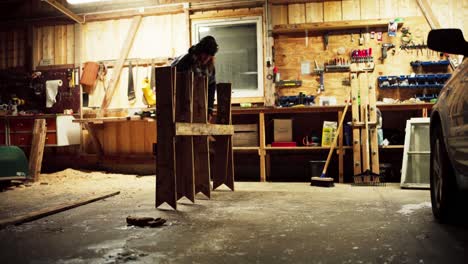 a man is in the process of making a sawbuck in indre fosen, trondelag county, norway - static shot