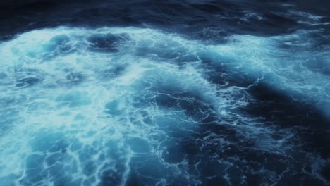 rough blue ocean water background of choppy waves at sea abstract of swell on a cruise ship boat trip crossing drakes passage, dangerous ocean causing motion sea sickness making poeople sea sick