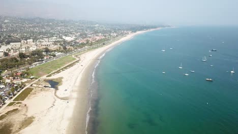 Santa-Barbara-dolly-from-blue-ocean-with-boats-to-downtown