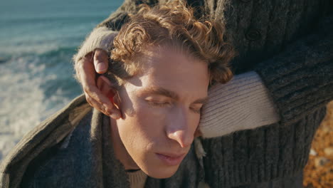 curly man bonding girlfriend at sunlight ocean closeup. lady caressing boyfriend