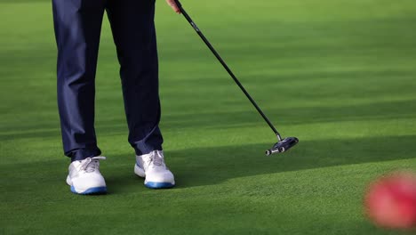 close-up-shot-of-golfer-during-putting-shot