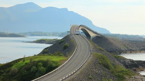 caravan car rv travels on the highway atlantic ocean road norway.